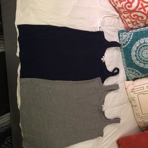 Three tank tops, blue, gray, and white